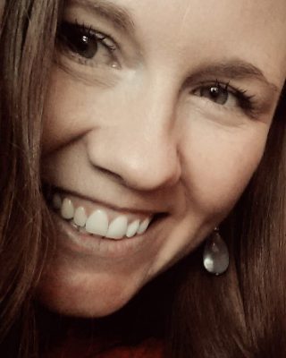 Photo of Jessica Arden, a 40 something woman with brown hair smiling
