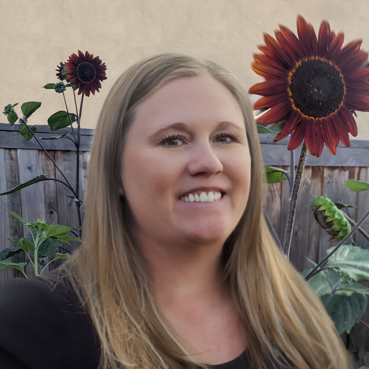 Jessica Arden smiling in a field of sunflowers